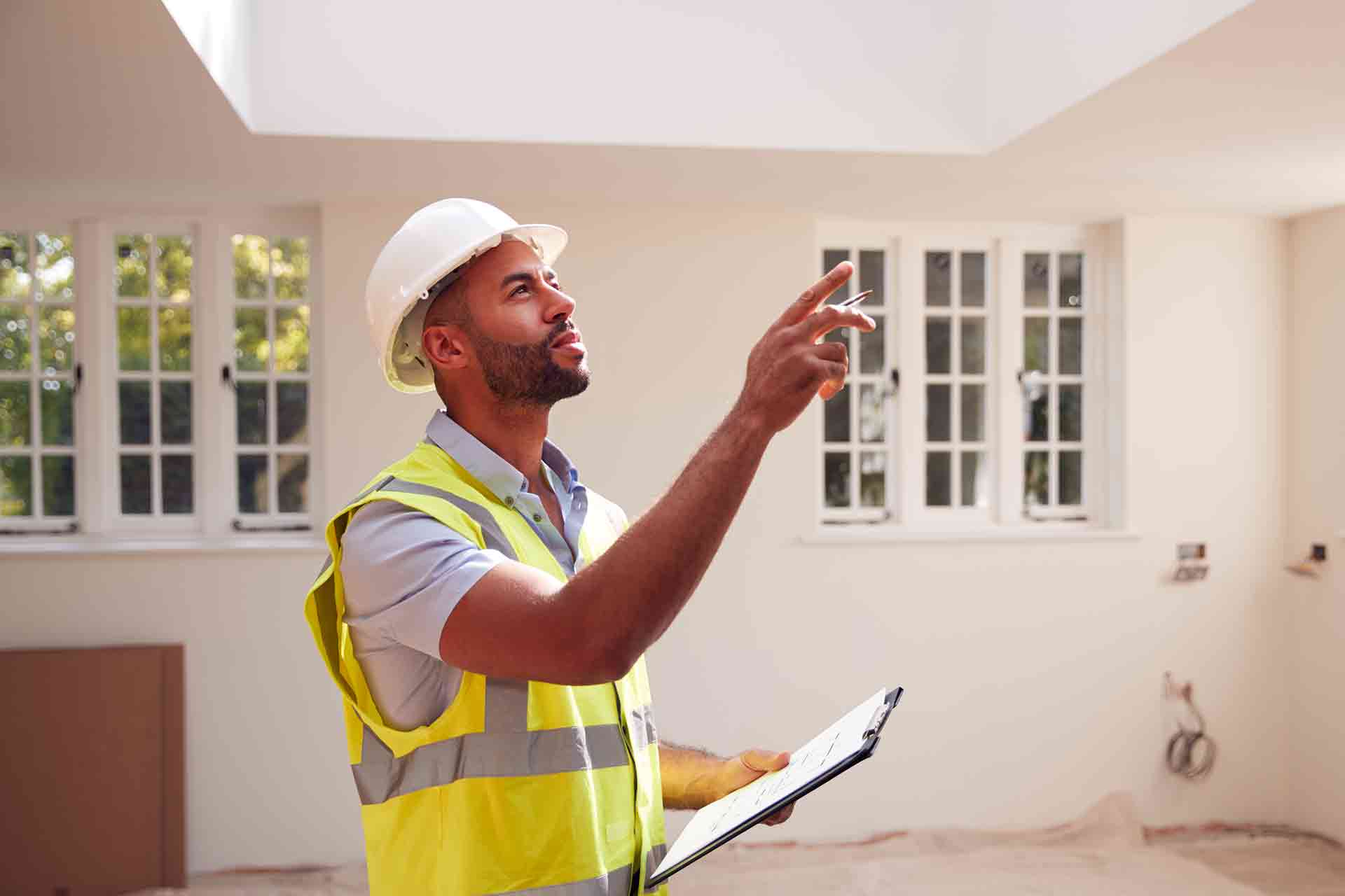Third Party Wall Surveyors Bournemouth reviewing plans between two parties during a dispute